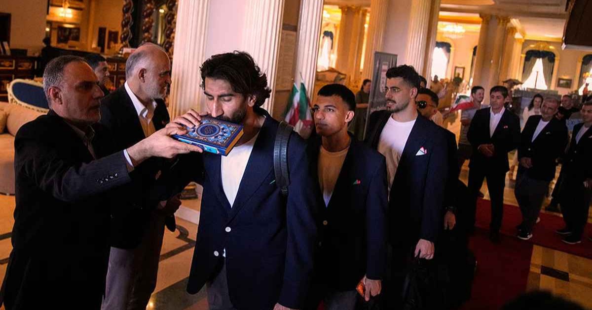 Iran football team leaves for World Cup after Quran tribute